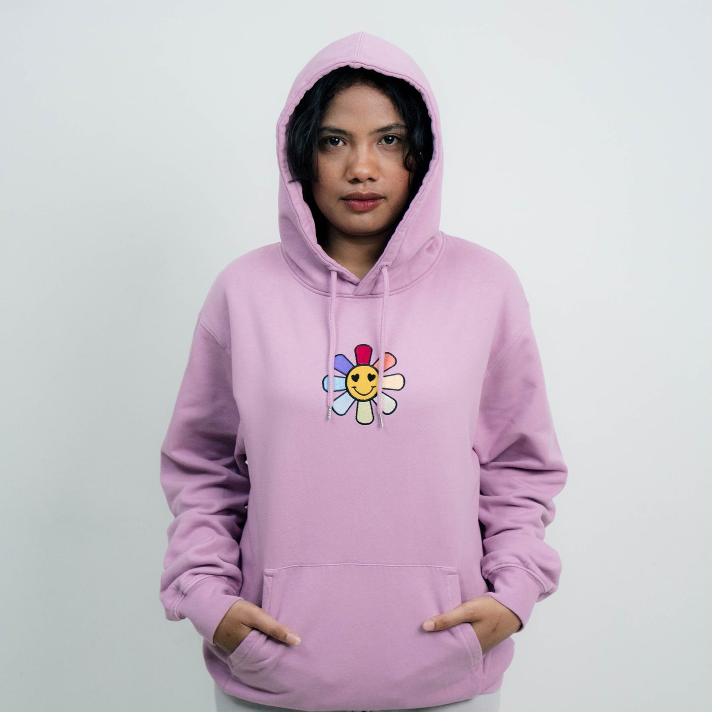 Female model wearing A Sleeping Samurai Happy Flowers Pink Hoodie with hood up