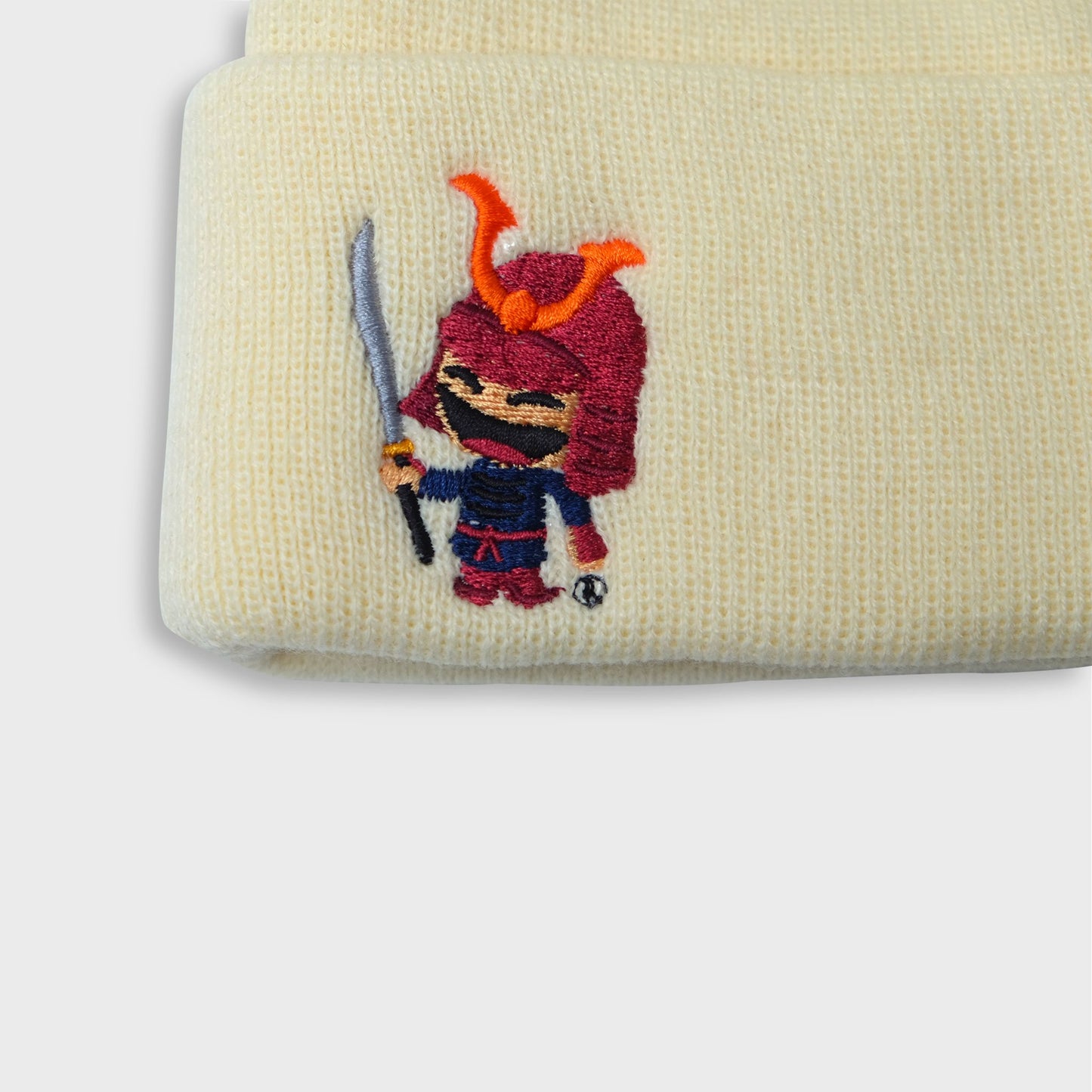 A Sleeping Samurai New Era Yellow Beanie front closeup view