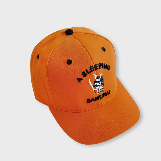 A Sleeping Samurai Kinmokusei baseball cap in orange and black front side view