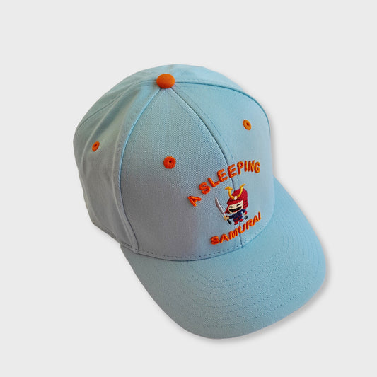 A Sleeping Samurai Street Racer baseball cap in frost blue and orange side view