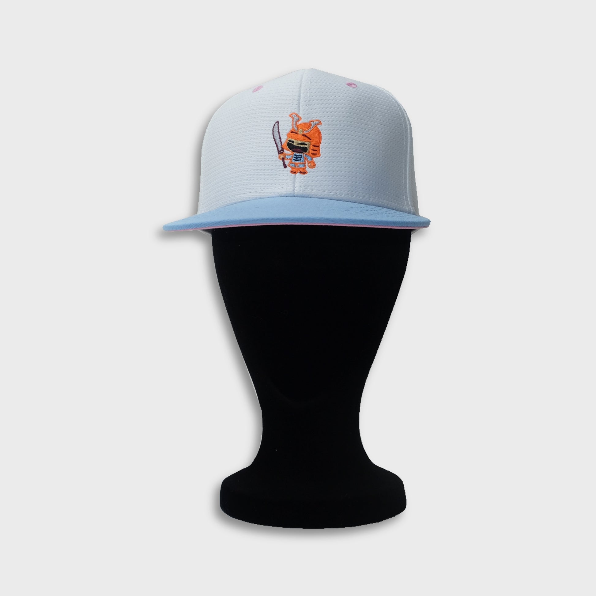 A Sleeping Samurai Sakura baseball cap in white, pale blue, and pink on dummy front view