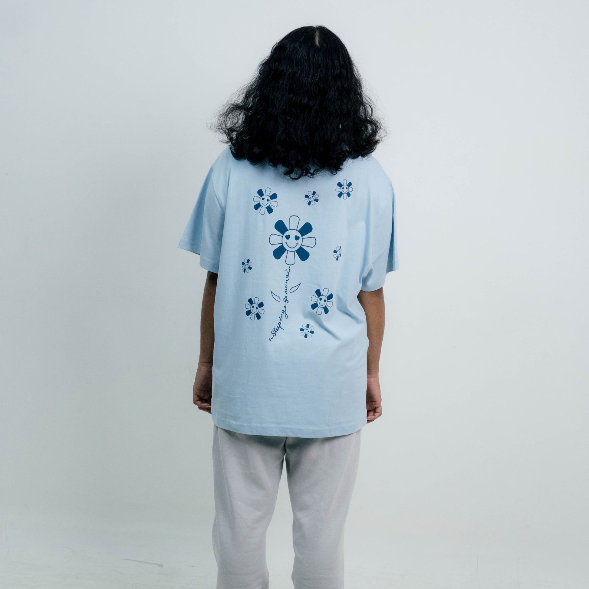 Model Wearing A Sleeping Samurai Happy Flowers Light Blue T-Shirt Back